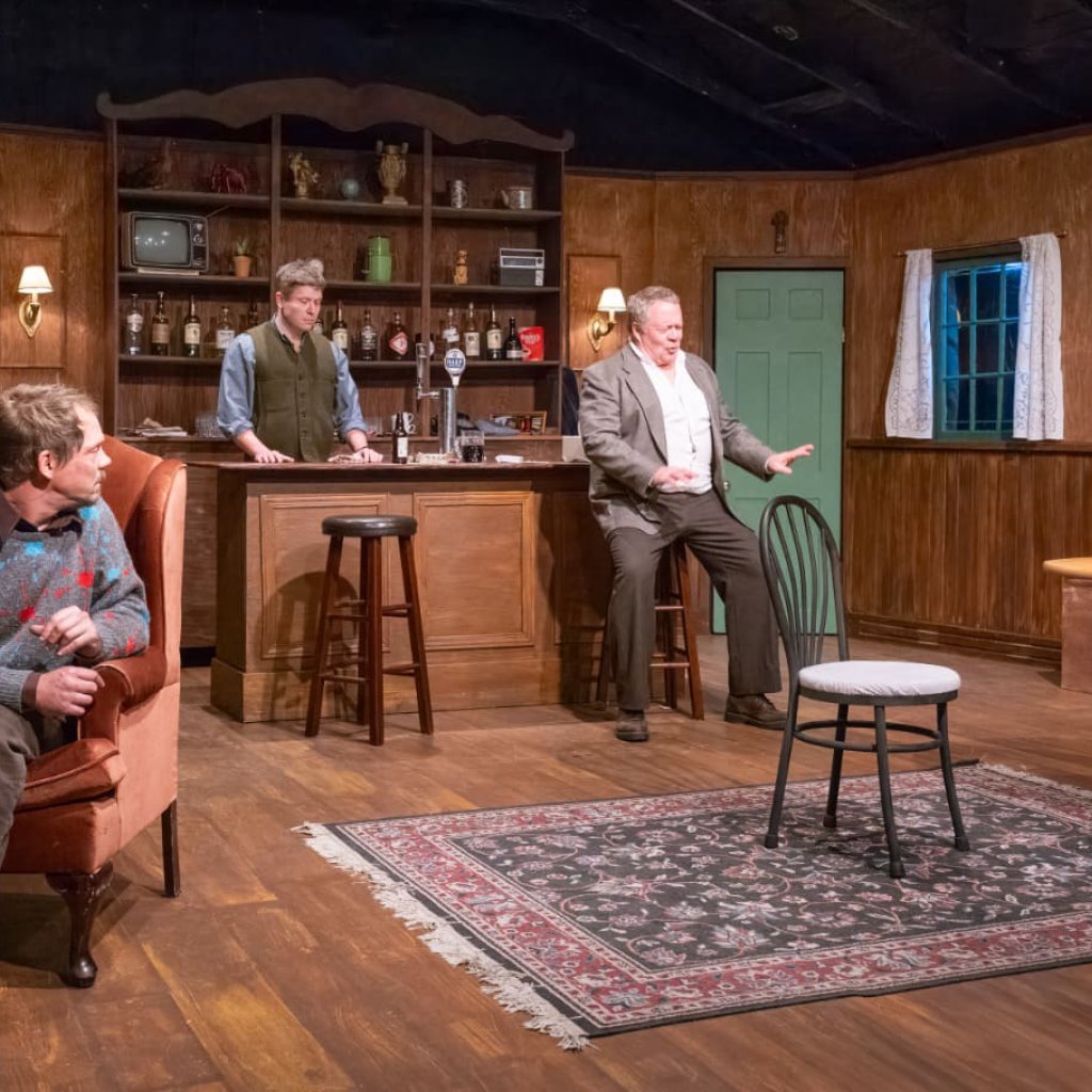 Four patrons and a bartender in an Irish pub