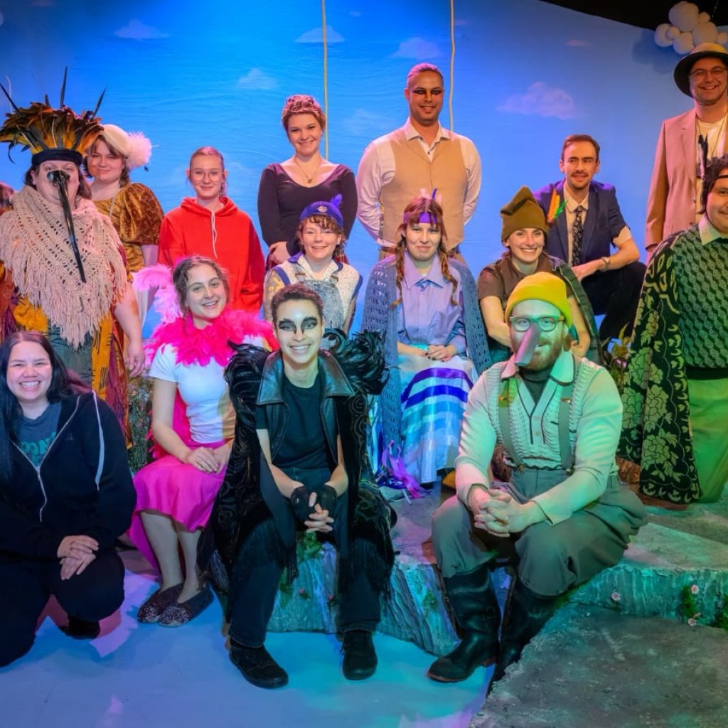 Group of actors dressed in costumes to resemble birds